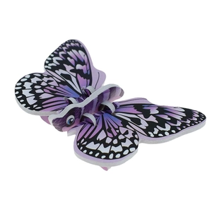 Detail showing the 3D butterfly puzzle assembly with purple and black wing patterns