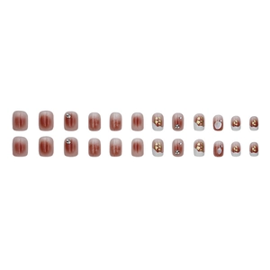 Short square red gradient press-on nails with French tips, stars, and rhinestones