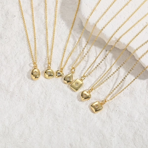 Seven minimalist gold-plated hexagram star necklaces with zircon pendants on stone