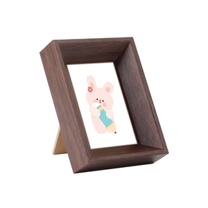 Minimalist dark brown wood picture frame with cute cartoon rabbit illustration and stand