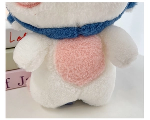 Close-up of plush doll texture showing delicate white pink and blue fiber materials