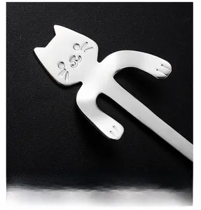 Close-up of cute cat-shaped handle on a polished 304 stainless steel coffee spoon
