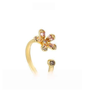 Detail of flower-shaped ring with pink rectangular zircons and gold finish