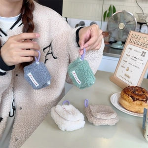 Close-up of plush fleece earphone storage pouches with colorful woven neck straps