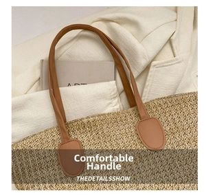Detail of straw woven tote with brown PU leather handle and fine stitching craft