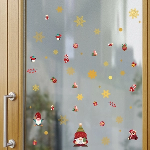 Stickers de Noël avec Père Noël et flocons de neige sur une porte en verre dépoli