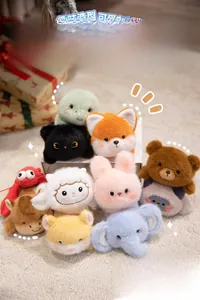 Group of cute plush animal magnets like rabbits and elephants in a gift box arrangement
