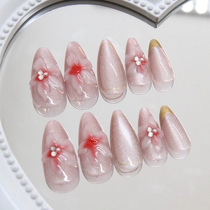 Handmade cat eye press-on nails with 3D floral carving and rhinestones in soft purple