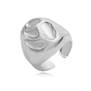Detailed macro view of irregular molten silver ring surface with glossy finish