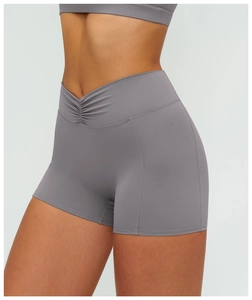 Detailed back view of dark gray high-waisted yoga shorts with ruched v-cut lifting effect