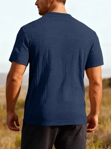 Outdoor back view of men's navy blue t-shirt with geometric check texture and slim fit