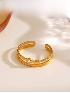 Detail of a 18K gold-plated double-layer open ring featuring sparkling zirconia stones