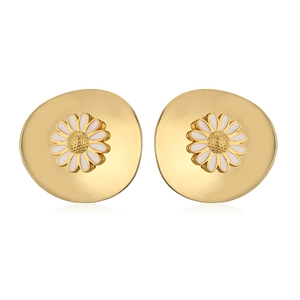 Macro shot of white enamel daisy earrings with gold centers and metal flower petals