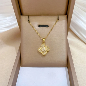 Titanium steel lucky clover jewelry set with gold necklace and earrings in a gift box