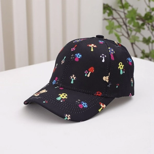 Close-up of black kids baseball cap featuring colorful bear and mushroom cartoon prints