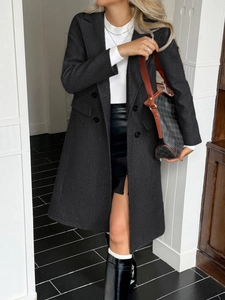 Deep grey double-breasted wool coat for women with classic lapels and mid-length fit