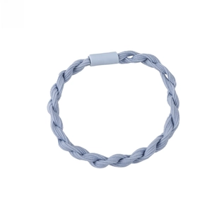 Macro detail of a light blue braided elastic hair tie with a matching rubber joint