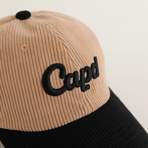 Kids corduroy baseball cap in khaki and black with Capd embroidery and curved brim