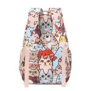 Detail of pink backpack with cartoon cat patterns and durable waterproof fabric