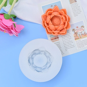 White silicone lotus flower candle mold with detailed orange wax finished product