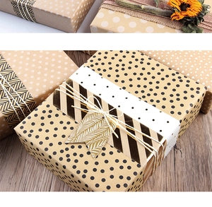 Detail of eco-friendly kraft gift wrapping paper with vintage patterns and jute twine