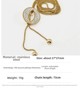 Detail of 18K gold plated stainless steel necklace with diamond-encrusted circle pendant