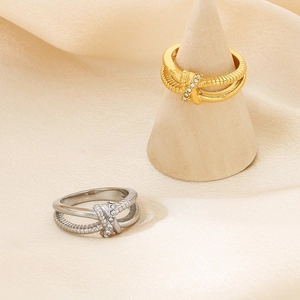 Elegant 18K gold and silver plated stainless steel knotted ring with small crystals