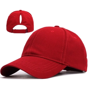 Solid red ponytail baseball cap for women with adjustable velcro back and cotton finish