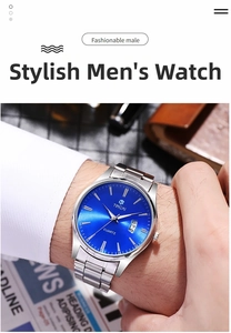 Close-up of men's steel watch featuring a blue sunray dial and a date window on the wrist