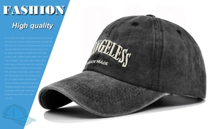 Close-up of white ANGELESS embroidery on charcoal grey washed denim baseball cap