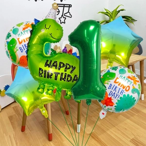 Detail of 6-piece green dinosaur first birthday balloon set with number one and stars