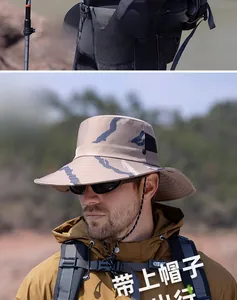 Close-up of khaki camo fishing hat featuring wide brim and adjustable windproof cord