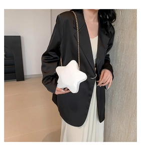 White star-shaped crossbody bag with glossy finish and gold chain strap detail