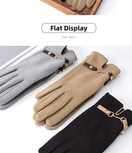 Detailed flat lay of winter gloves in grey, camel, and black with metal horsebit buckles