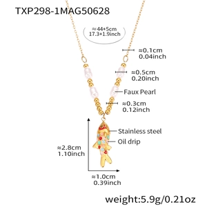 Detail showing rainbow fish pendant with gold stainless steel chain and faux pearls