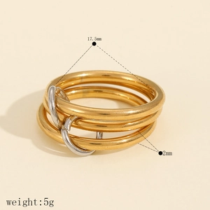 Detail showing stacked multi-layered gold and silver rings with size and weight specs