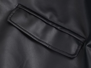 Macro detail of high-quality black PU leather jacket pocket with precise stitching