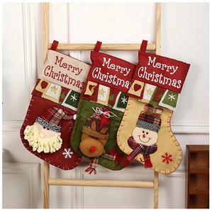 Detailed view of 3D Santa, reindeer, and snowman Christmas stockings on a wooden rack
