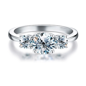 Detailed view of 1ct moissanite three-stone silver ring with round-cut gemstones