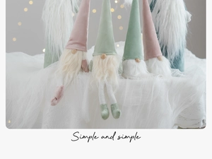 Detail of pink and green Christmas Gonk gnomes with long white beards and tall pointed hats