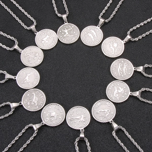 Detailed circle of 12 silver zodiac coin necklaces with engraved constellations