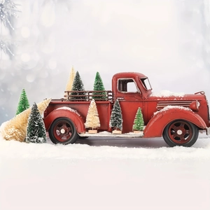 Vintage red metal truck decor with mini sisal Christmas trees and faux snow frosting