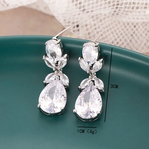 Macro detail of drop zircon earrings showing 3cm length and 1cm width dimensions