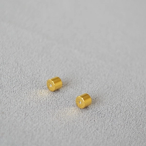 Macro shot of 18K gold plated brass earring backings with silicone safety inserts