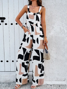 Women's wide leg jumpsuit with abstract geometric patterns and adjustable straps