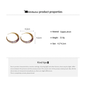 Detailed spec view of crescent moon gold plated earrings with zircon stones and 4.2cm size