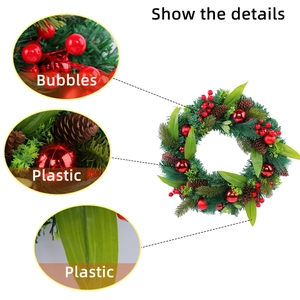 Christmas wreath with red berries and pine cones for front door holiday decoration