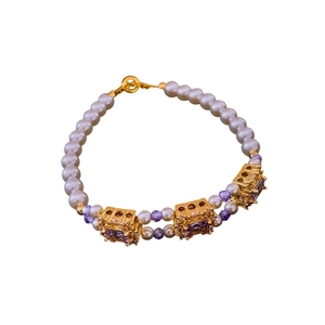 Vintage pearl bracelet featuring purple square zircon pendant and golden accents