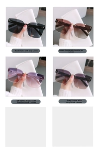 Detail of rimless oversized sunglasses in black, brown, cream and gray stylish colors