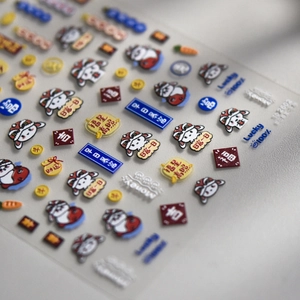 Macro view of 3D embossed nail stickers featuring cute tigers and lucky characters